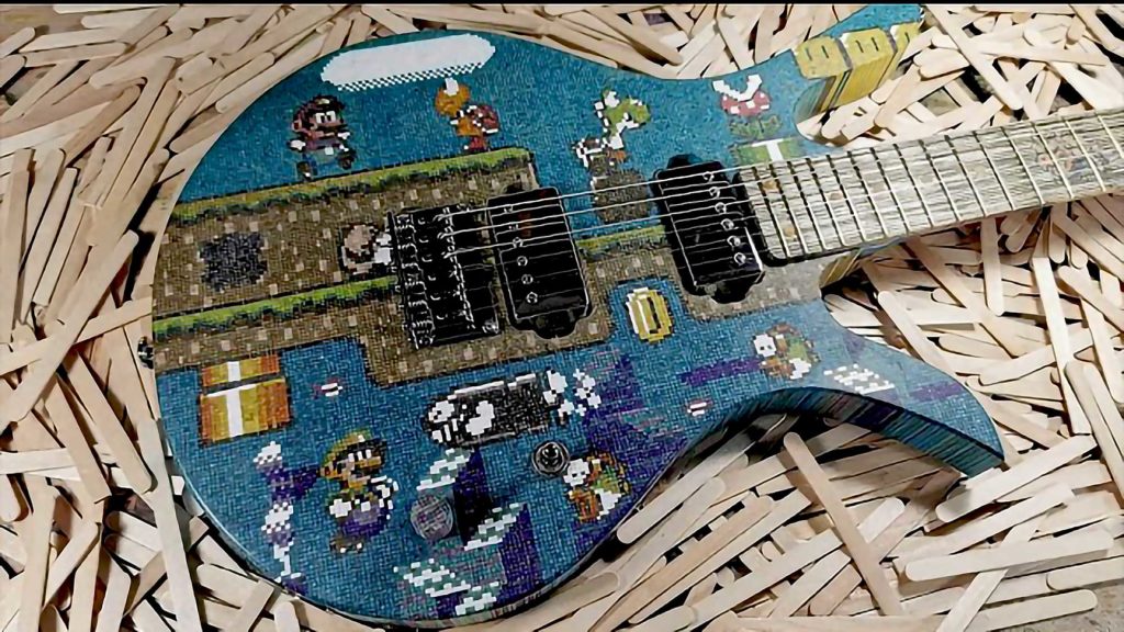 10,000 Popsicle Sticks Were Used To Create This Super Accurate, Pixelated Super Mario Guitar