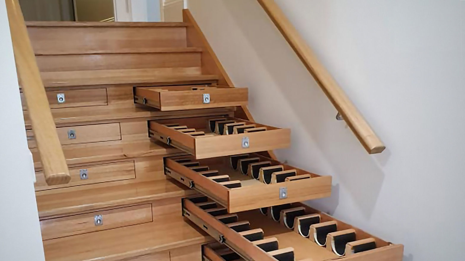 Builder Turned Staircase’s Dead Space Into A Wine Storage Using OffThe