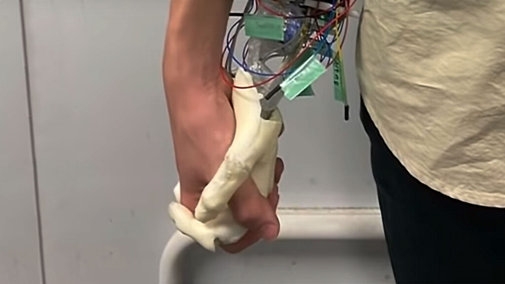 Robotic Hand Simulates Holding A Girl’s Hand