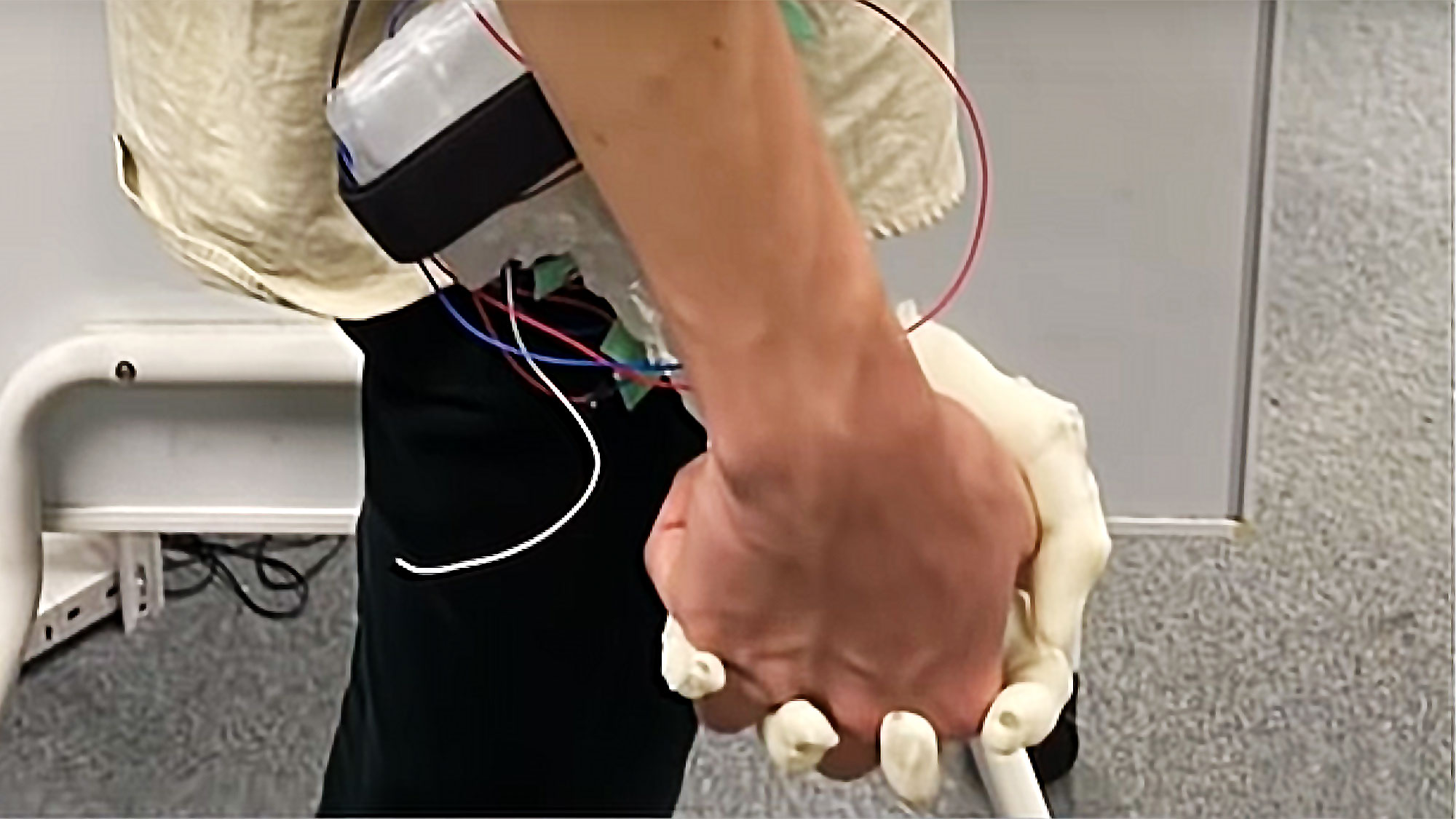 Robotic Hand Simulates Holding A Girl’s Hand