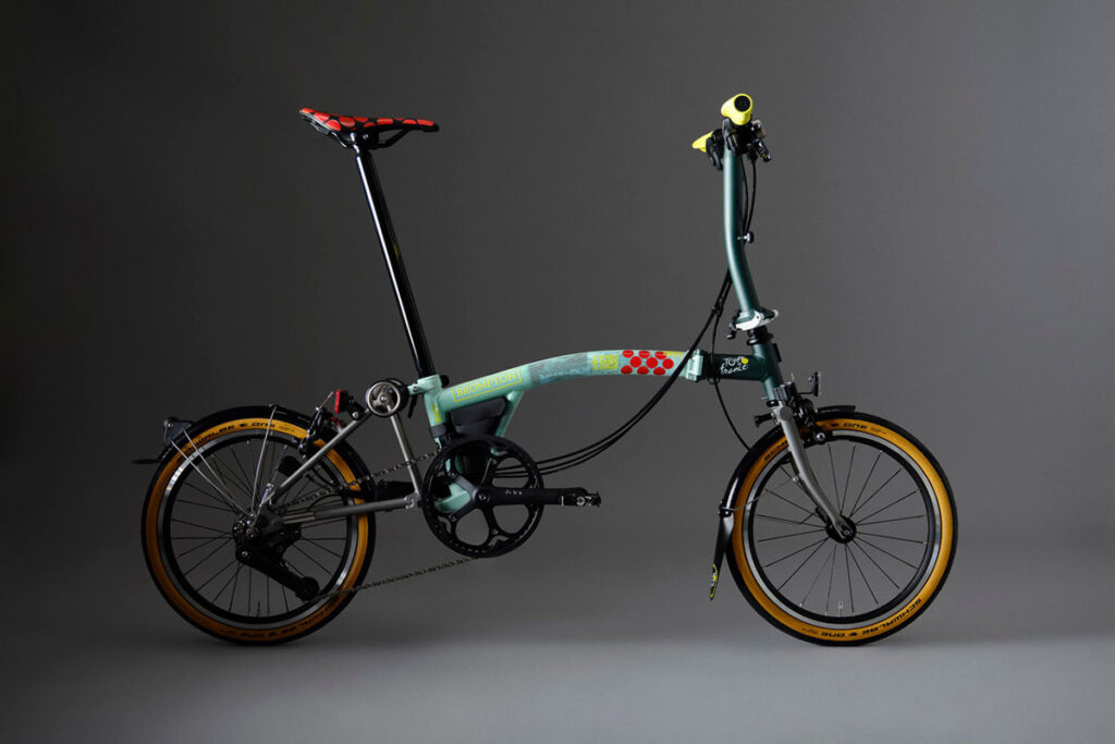 Brompton Tour de France P Line trifold bike in Sprinters Light Green with raw titanium frame and Tour graphics