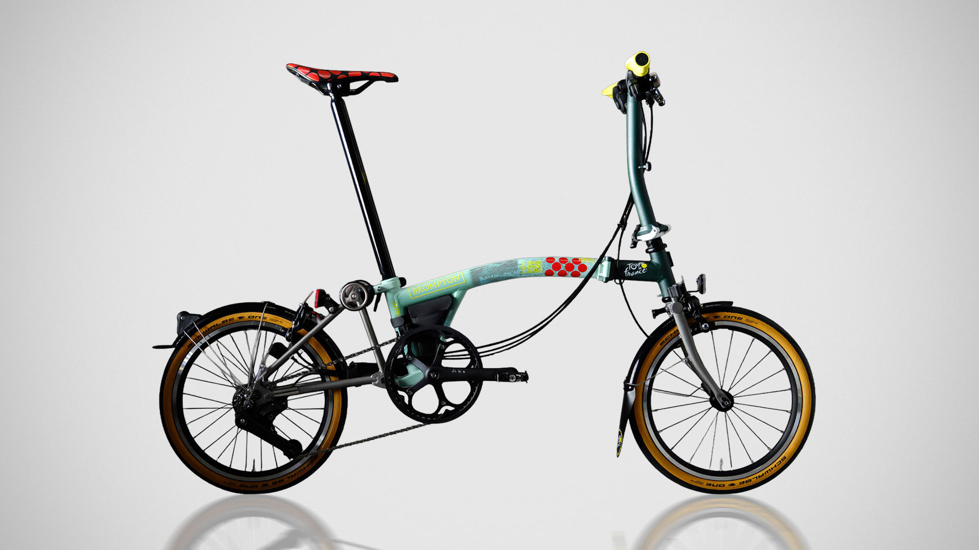 Brompton x Tour de France trifold C Line and P Line bicycles featuring race-inspired graphics and yellow accents