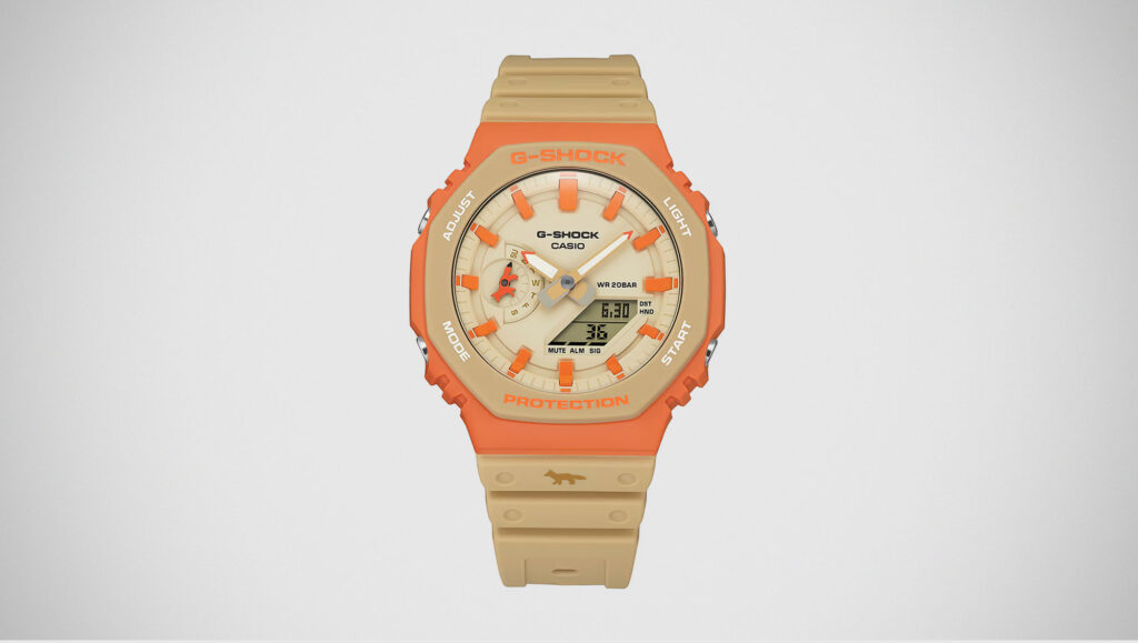 G-Shock Maison Kitsuné GA2110MK-5A collaboration watch with orange bezel and neutral Paris-inspired colorway