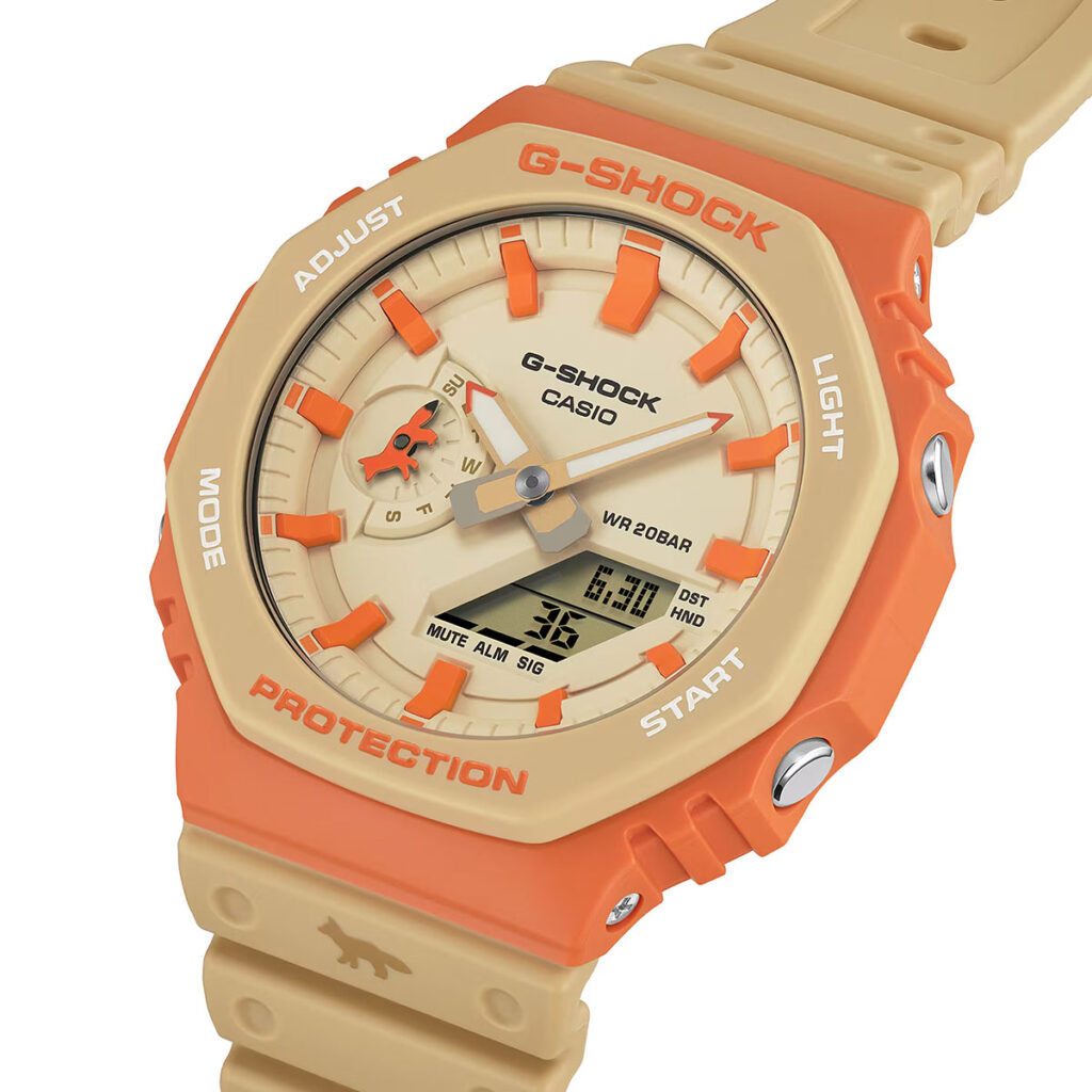 G-Shock Maison Kitsuné GA2110MK-5A collaboration watch with orange bezel and neutral Paris-inspired colorway