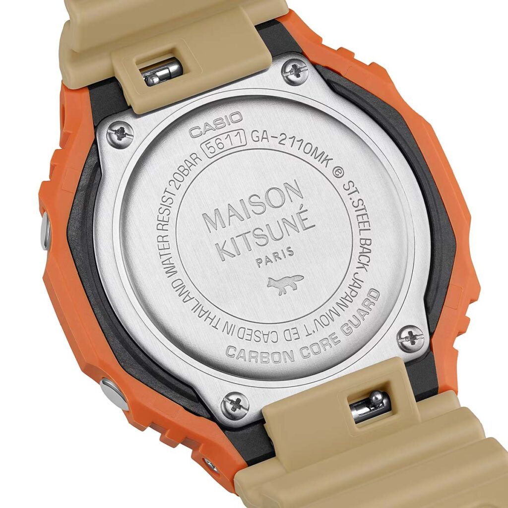G-Shock Maison Kitsuné GA2110MK-5A collaboration watch with orange bezel and neutral Paris-inspired colorway