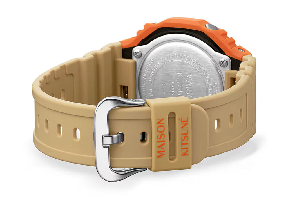 G-Shock Maison Kitsuné GA2110MK-5A collaboration watch with orange bezel and neutral Paris-inspired colorway