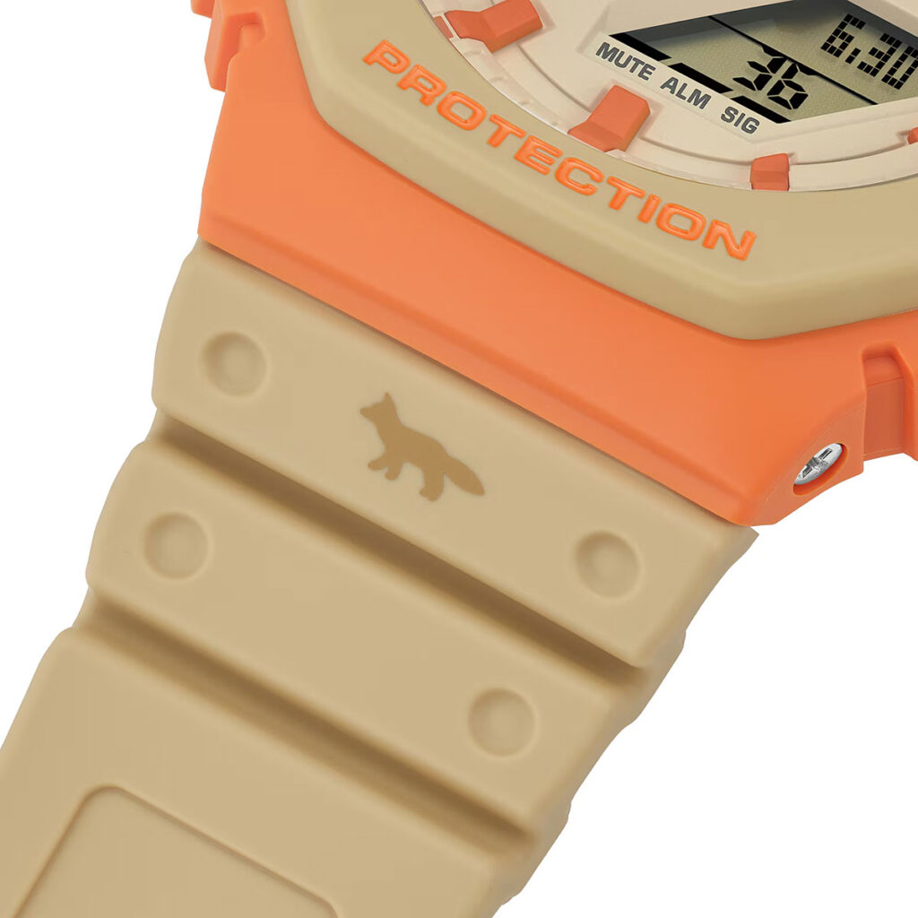 G-Shock Maison Kitsuné GA2110MK-5A collaboration watch with orange bezel and neutral Paris-inspired colorway