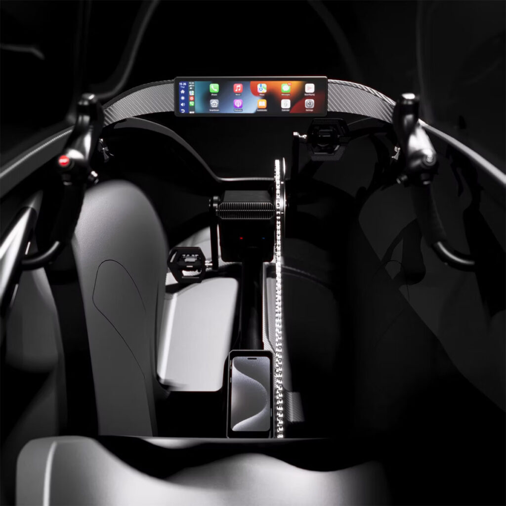 IRIS eTrike cockpit with touchscreen dashboard, mirror cameras, and climate-controlled cabin