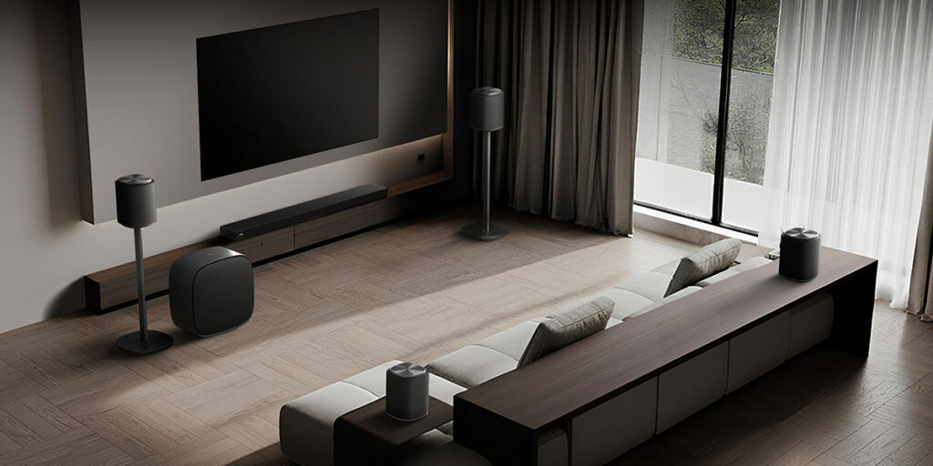 LG Sound Suite with H7 soundbar, wireless surround speakers, and subwoofer showcasing Dolby Atmos FlexConnect modular home audio system