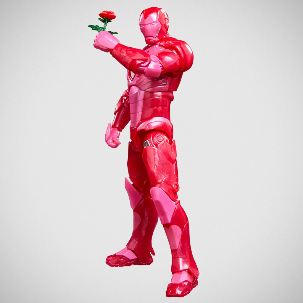 Marvel Legends I Love You 3000 Iron Man action figure holding a rose with heart-shaped Arc Reactor and pink-themed packaging