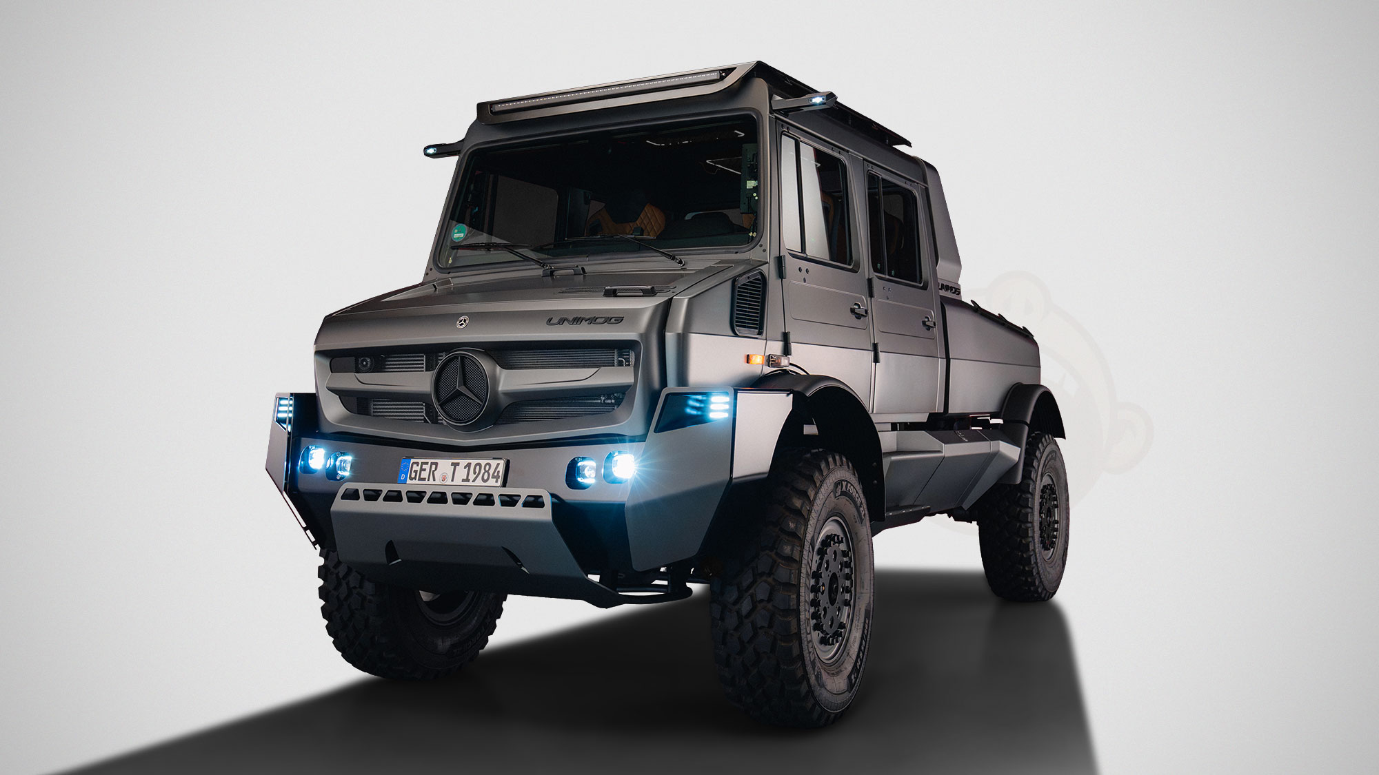 Mercedes-Benz Special Trucks luxury Unimog show car in matte grey with beadlock wheels, LED lighting, and premium off-road design