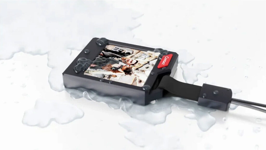 PhotoTag Bluetooth keychain tracker with color e-ink display showing a photo, compatible with Apple Find My and Android Find My Device