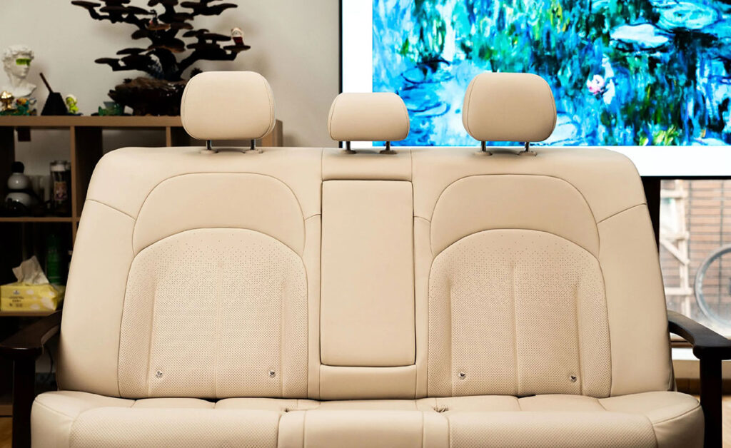 Dongfeng Nissan N6 Sofa made from the N6 car’s rear seat with wooden armrests and Nissan-branded cushions