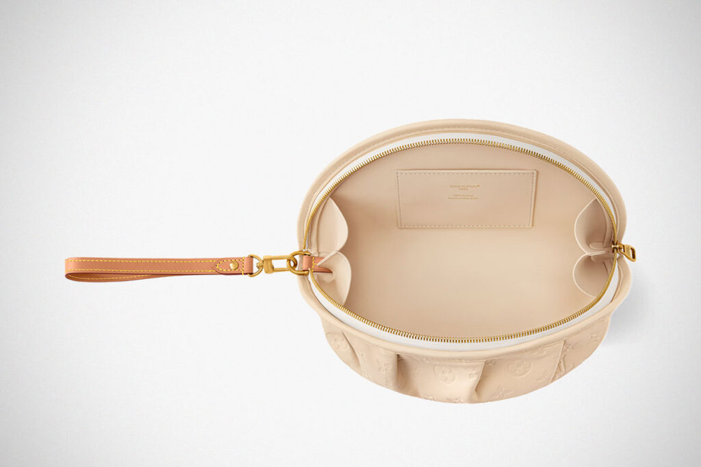 Louis Vuitton Gyoza Pouch in beige Monogram leather with dumpling-inspired folded design