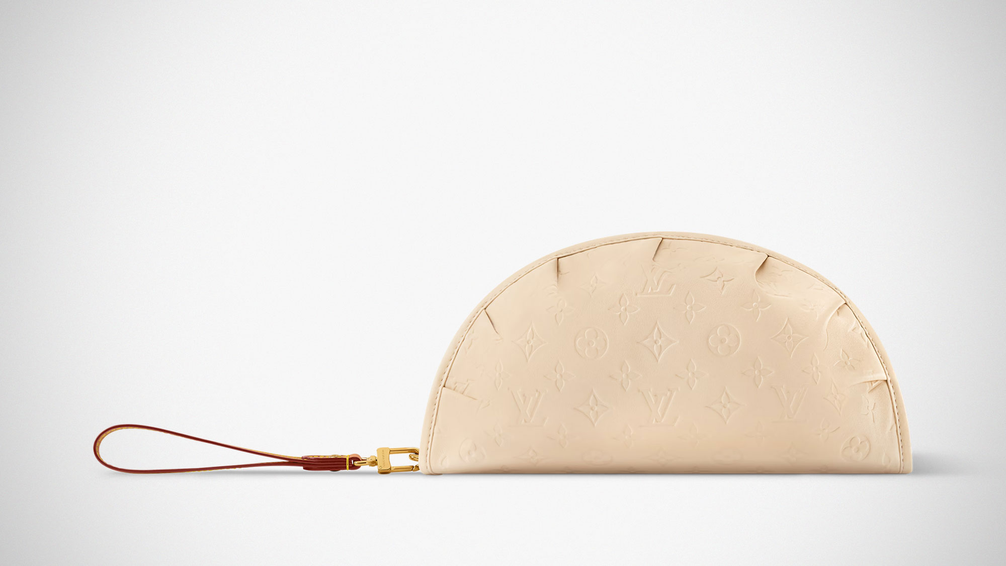 Louis Vuitton Gyoza Pouch in beige Monogram leather with dumpling-inspired folded design