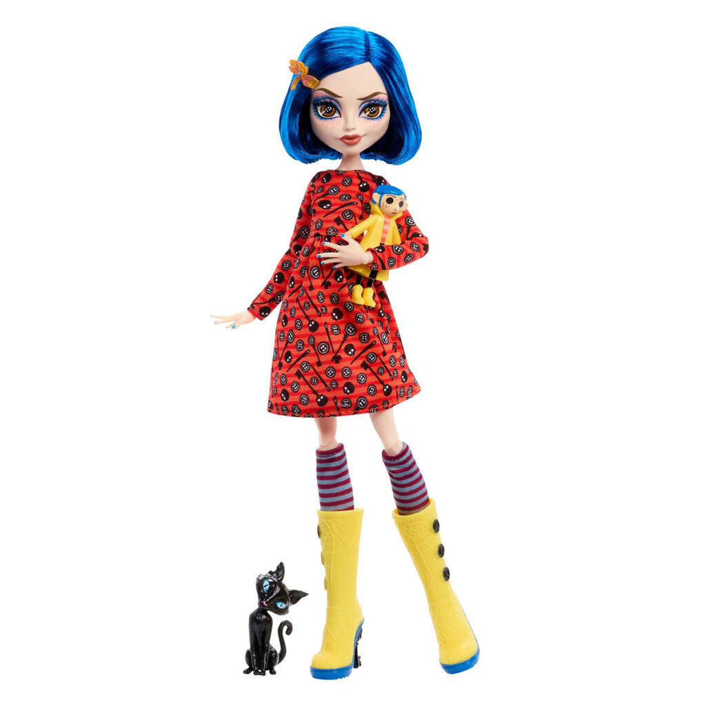 Monster High Skullector Coraline doll wearing yellow raincoat with rag doll and cat accessories