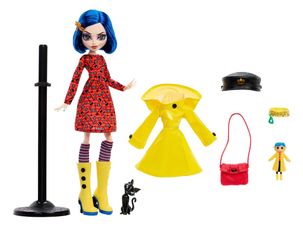 Monster High Skullector Coraline doll wearing yellow raincoat with rag doll and cat accessories