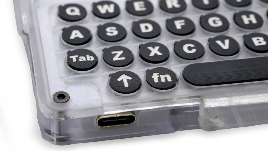 PocketMage e-paper personal digital assistant with physical keyboard and transparent case